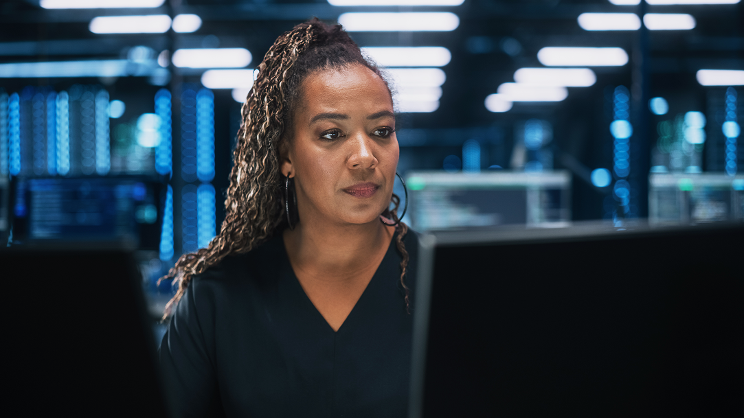 Woman in office looking at screen